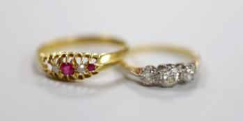 An 18ct, plat and three stone diamond set ring, size I and a George V 18ct gold and five stone