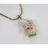 A modern two colour 9ct gold and diamond chip set double scroll pendant necklace, overall 44cm,