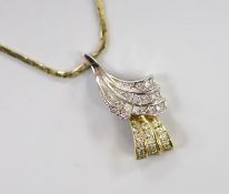 A modern two colour 9ct gold and diamond chip set double scroll pendant necklace, overall 44cm,