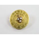 An early 20th century Russian 56 zolotnik yellow metal and seed pearl set circular brooch, 22mm,