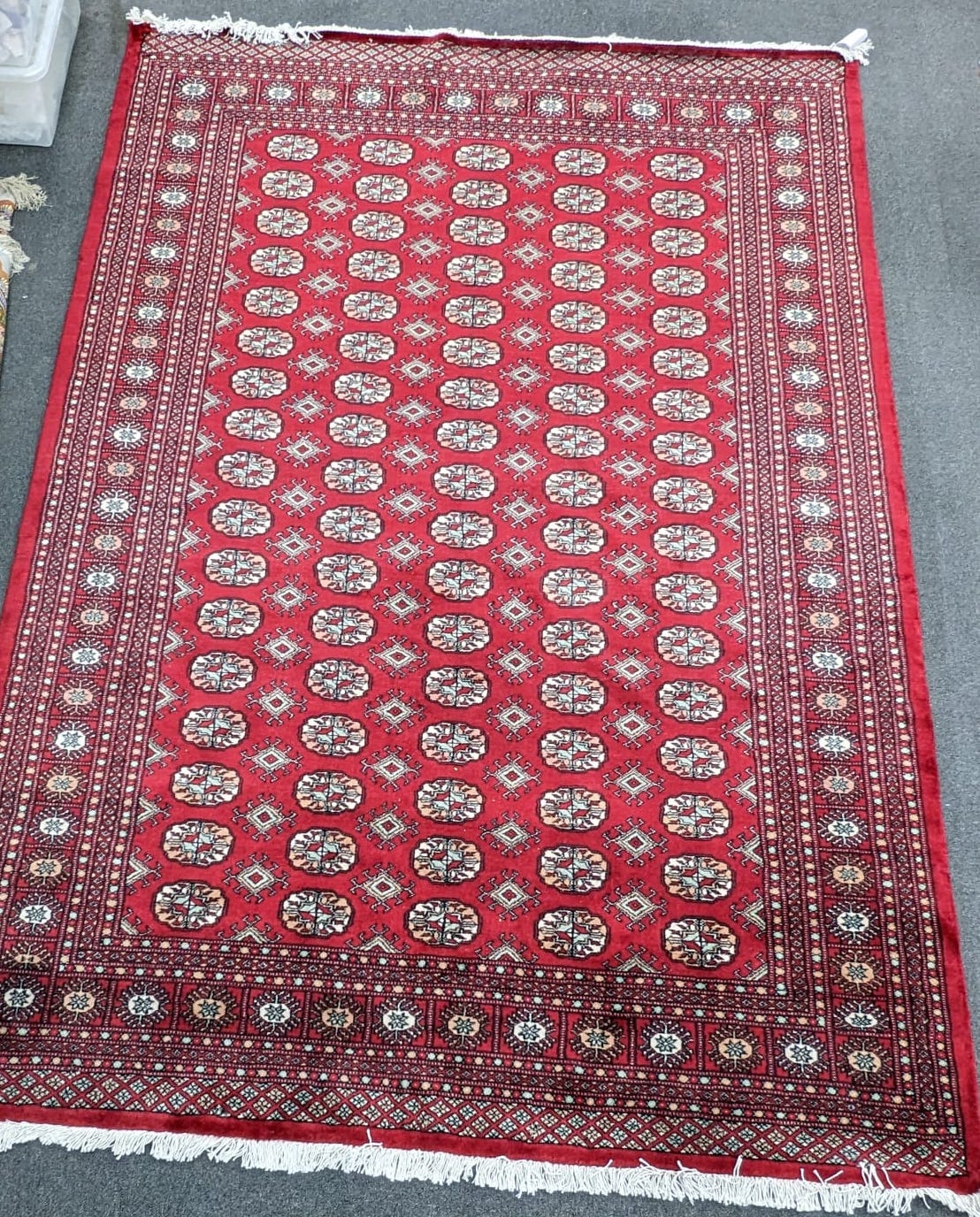 A Bokhara red ground carpet, 280 x 194cm