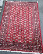A Bokhara red ground carpet, 280 x 194cm