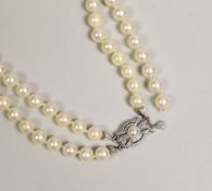A mid to late 20th century double strand cultured pearl necklace, with cultured pearl set two colour