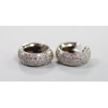 A modern pair of 750 white metal and pave set diamond chip half hoop earrings, 15mm, gross weight