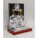 An empty Baccarat Remy Martin Louis XIII decanter, in display case with booklet
