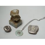 A Chinese jadeite lion-dog seal (black matrix), a similar pendant and two ingots