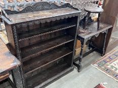 An early 20th century carved oak open bookcase, width 92cm, depth 26cm, height 114cm, together