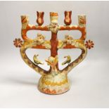 A Mexican Tree of Life painted terracotta candelabrum, 28cm high