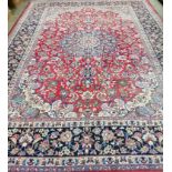 A large Najafabad red ground carpet, approx. 400 x 300cm