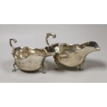 Two early 20th century silver sauceboats, with flying scroll handles, London, 1911 and Sheffield,