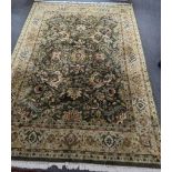 An Indian green ground floral carpet 300cm x 230cm