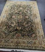 An Indian green ground floral carpet 300cm x 230cm