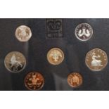 Assorted display sets of coins including two Canadian silver dollars