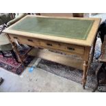 A late Victorian light oak two drawer writing table, width 120cm, depth 59cm, height 78cm