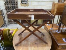 A Victorian mahogany butler's tray on folding stand, width 70cm, depth 44cm, height 70cmNB: From the