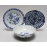 A Chinese blue and white ‘boys’ bowl and two blue and white flower plates, largest 24cm diameter