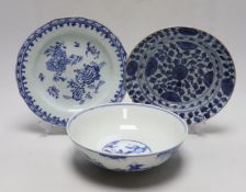 A Chinese blue and white ‘boys’ bowl and two blue and white flower plates, largest 24cm diameter