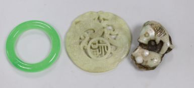 A Chinese hardstone carved roundel, a ring and a fish panel, roundabout 7cm diameter