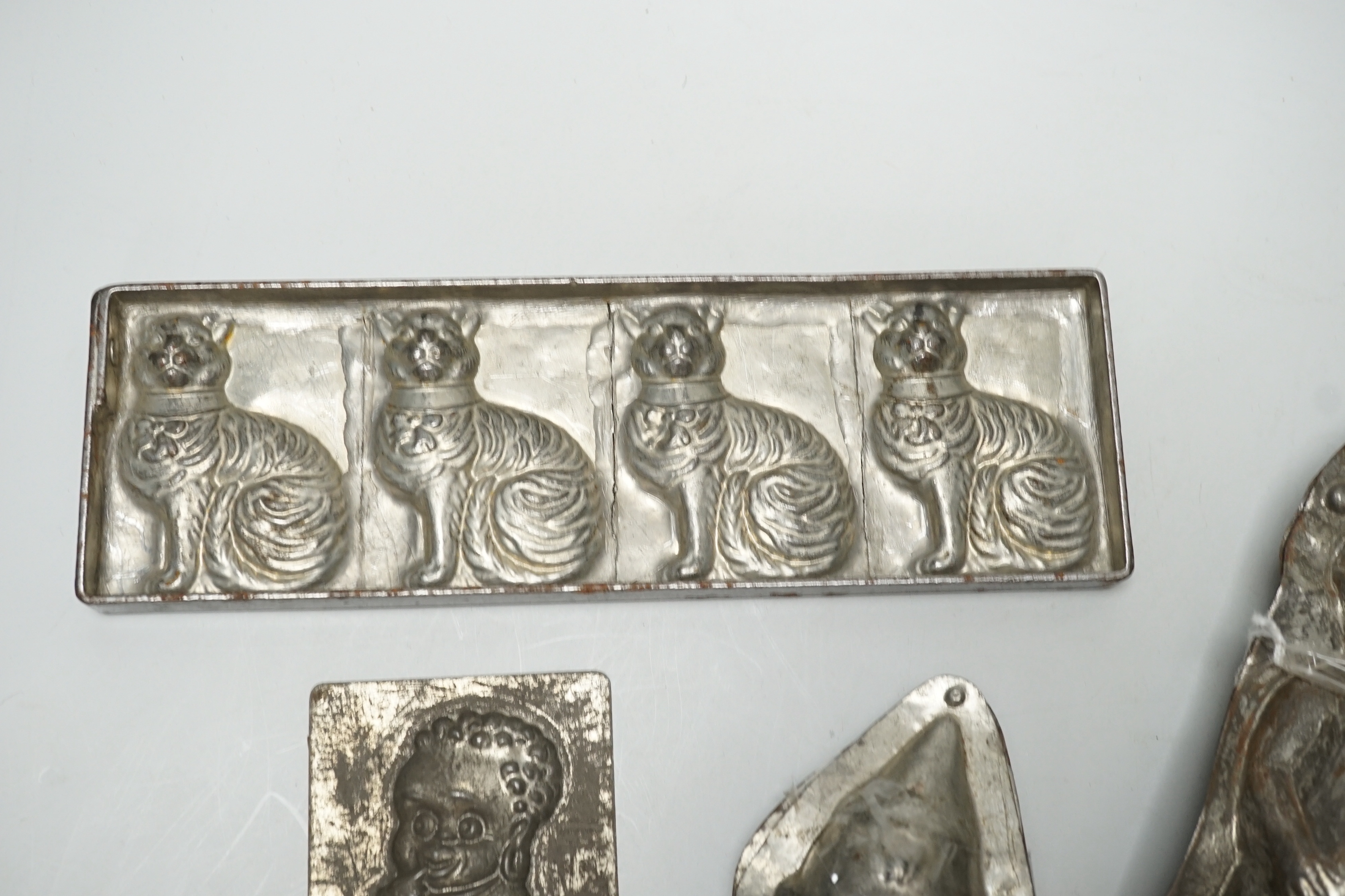 Four chocolate mould tins: a cat, a kewpie and two others - Image 7 of 15