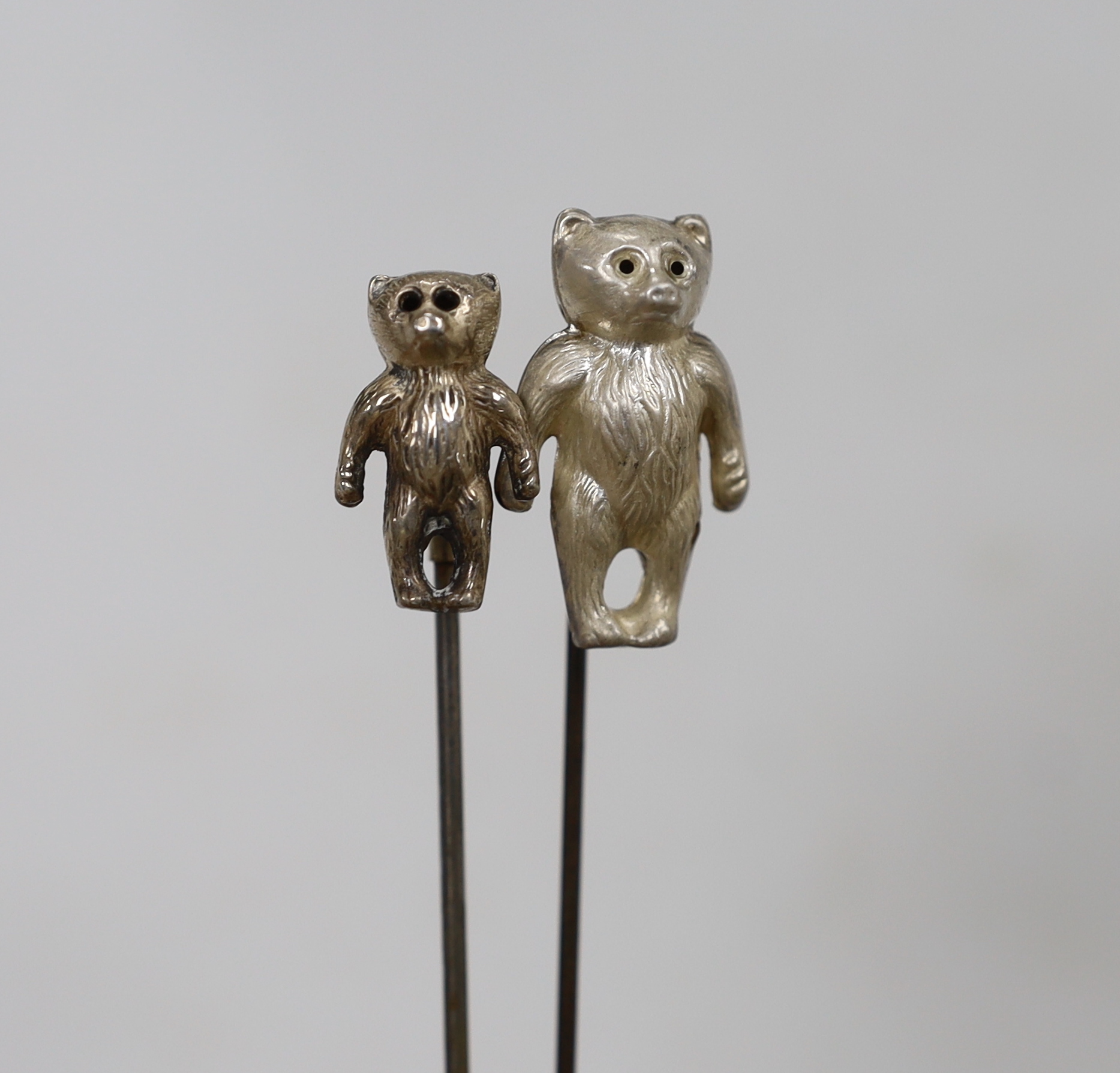 Two Edwardian hat pins with silver hallmarked teddy bea tops, and a silver 1960's teddy bear rattle - Image 3 of 9