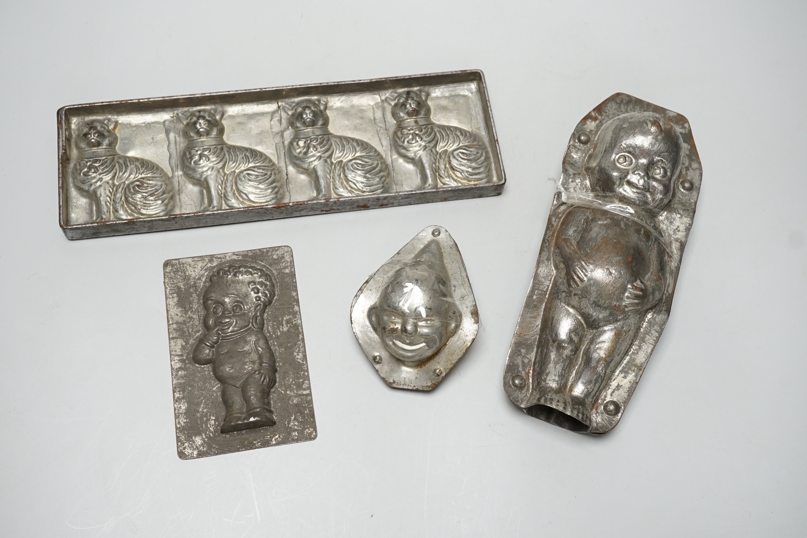 Four chocolate mould tins: a cat, a kewpie and two others - Image 11 of 15