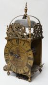 An English brass lantern clock with four branch finial decoration signed Tho Moore of Ipswich,