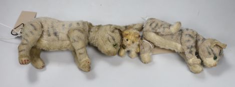 A Steiff Mini 'fluffy' cat, button, ribbon and bell, c.1925, 3in., some hair loss, and two Steiff