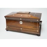 A William IV mother of pearl inlaid rosewood tea caddy, 31cm wide