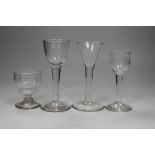 Two George II cordial glasses, a syllabub cup and another cordial glass, tallest 15cm high (4)