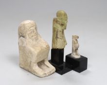 Three Ancient Egyptian pottery statuettes, largest 5cm wide, 7.5cm high The label stating bought