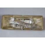 A harlequin set of eleven George III and later fiddle, thread and shell pattern dessert forks,