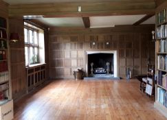 Oak panelling formerly in the library at Plumpton Place, as fitted to three walls in the room