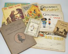 Mixed children's books, a pack of old postcards and three golly books by Francis Upton