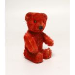 A red Schuco perfume bear, c.1920s, 5in., in excellent condition, missing stopper