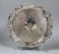 A late Victorian engraved silver salver, with wavy scroll border, Goldsmiths & Silversmiths Co,