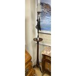 A figural bronze lamp with opaque flambe shade on mahogany torchere, height 210cm