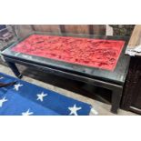 An Asian red stained hardwood coffee table, length 142cm