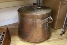 A large hammered copper cauldron and cover, 35cm high not including handle on cover
