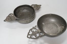 An 18th century French pewter two handled ecuelle, lacking cover, and one other, largest 27cm