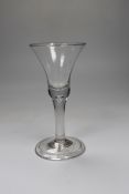 A George II wine glass, bell bowl with air-tear, folded foot, 16cm tall