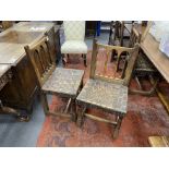 A set of four spindle back dining chairs with leather strapwork seats