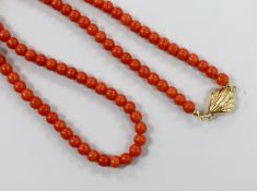 A single strand coral bead necklace, with 750 yellow metal clasp, 46cm.