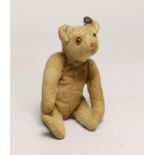 A Steiff rattle bear, with button, c.1920's, 5in., some hair loss