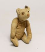 A Steiff rattle bear, with button, c.1920's, 5in., some hair loss