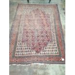 An antique North West Persian red ground rug, 170 x 118cm