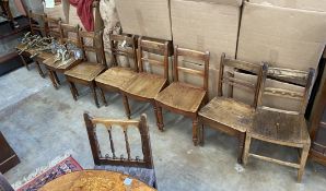 A harlequin set of nine early 19th century Provincial elm and fruitwood dining chairs