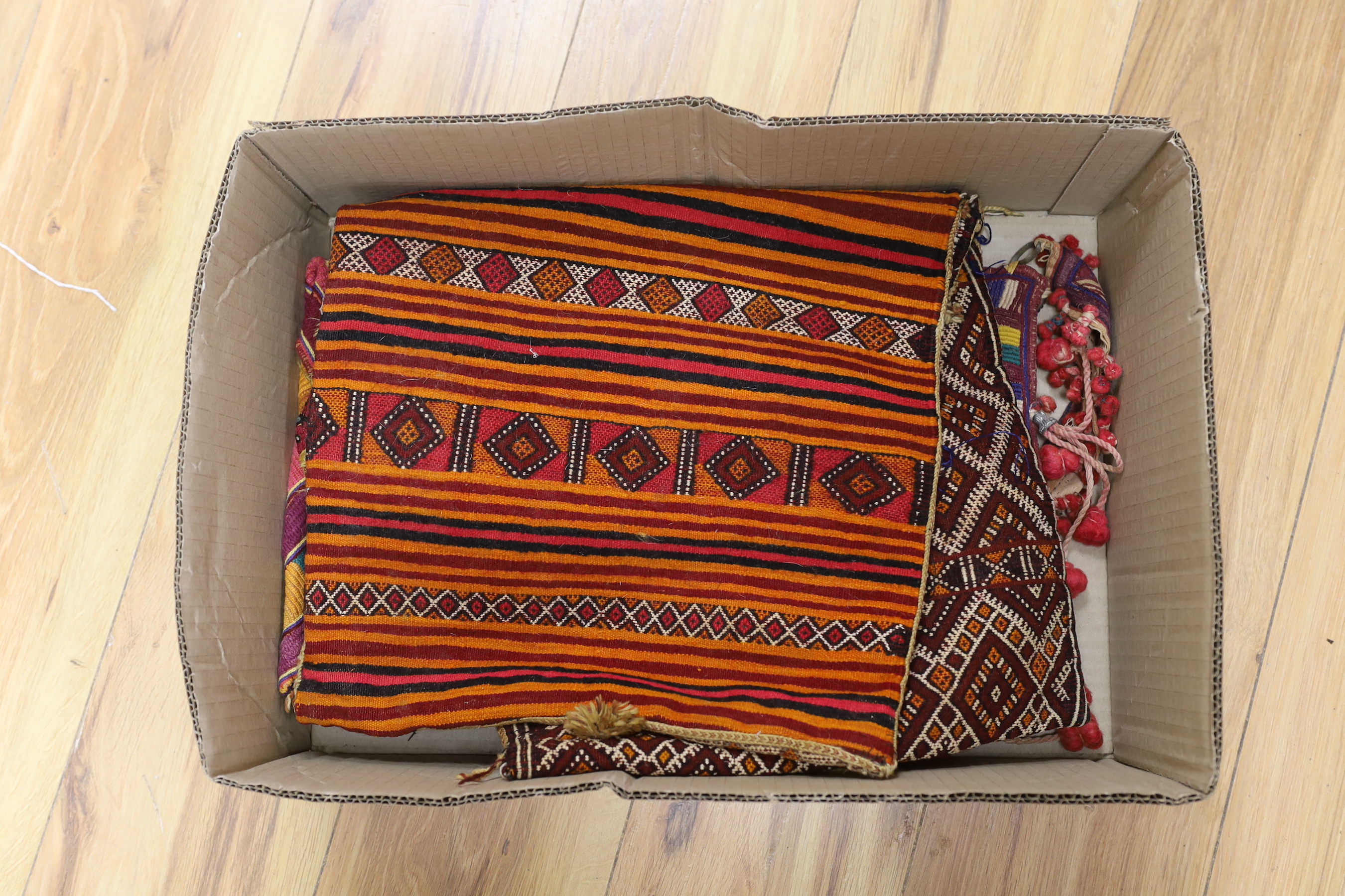 Two late 19th early 20th century Kohistani embroidered bags and a woven cushion cover/bag and a silk