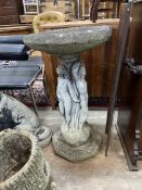 A reconstituted stone circular 'The Three Graces' bird bath, diameter 48cm, height 84cm