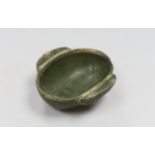 A Chinese Han dynasty green glazed stoneware ear cup, 9cm wide, 10cm long