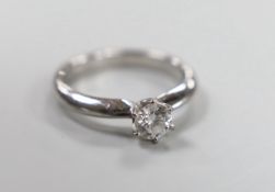 A modern 18ct white gold and solitaire diamond set ring, size N, gross weight 4.7 grams, stone